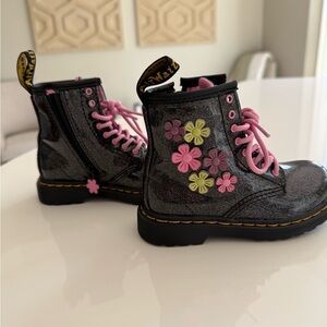 Little kid Doc Martens with flower appliqué.
